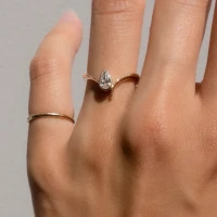 /public/photos/live/Delicate Solitaire Moissanite Eve Pear Cut Ring 894 (1).webp